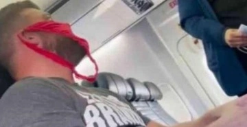 Uçağa maskesiz binen adam, uyarı alınca kız arkadaşının iç çamaşırını yüzüne taktı